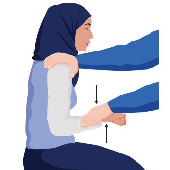 A woman is doing a bicep curl against clinician’s resistance